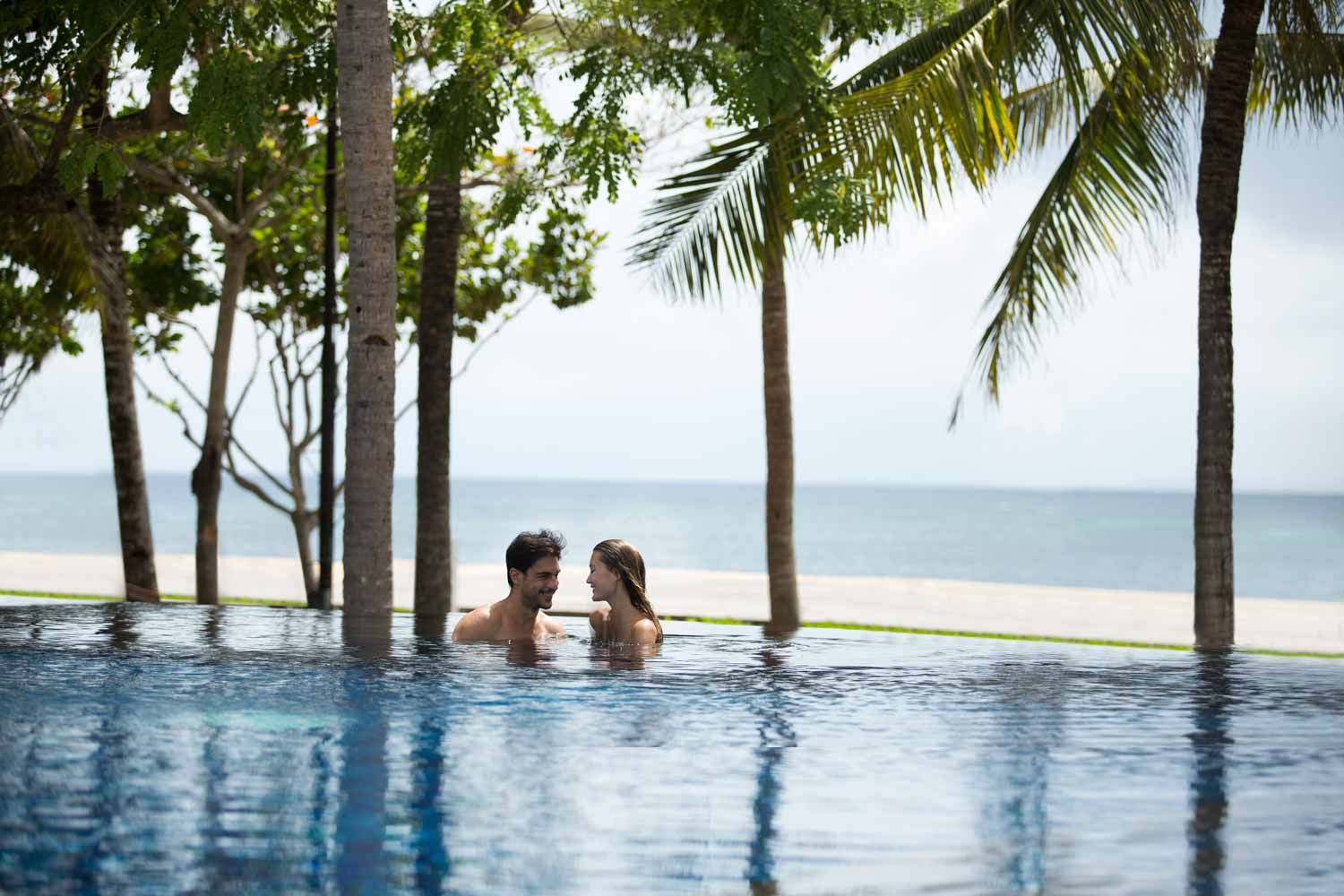 The oceanfront pool and beach garden at The Royal Santrian on Tanjung Benoa, Bali