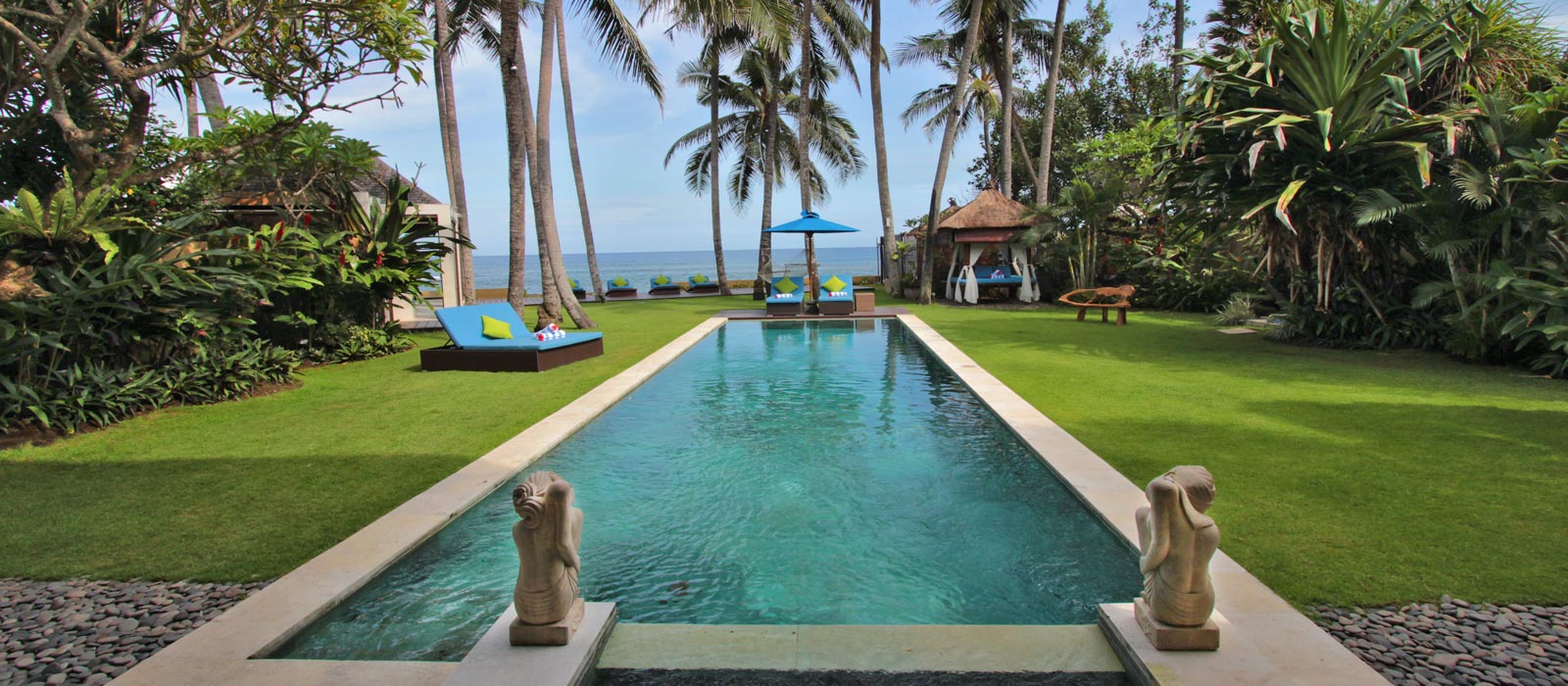 Pool at Villa Samudra with the beachfront garden and ocean beyond, Ketewel