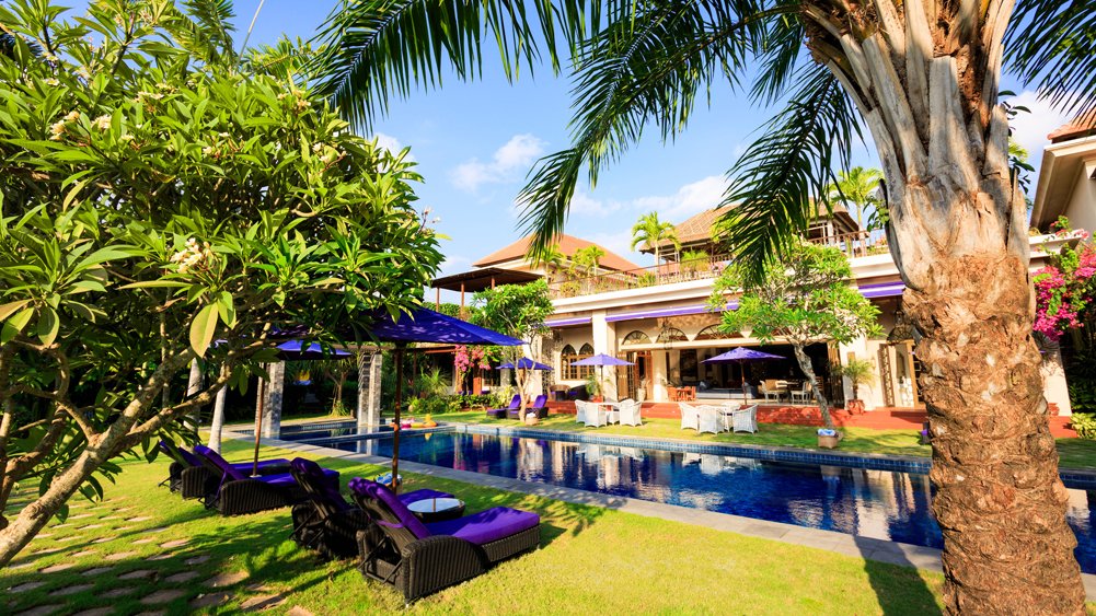 Lush tropical gardens surrounding Sayang d'Amour villa in Seminyak