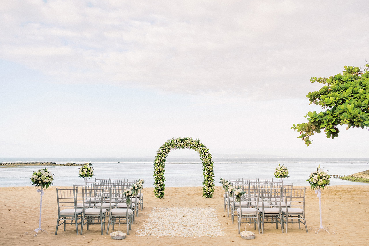 A beachfront wedding ceremony setting at Sofitel Bali Nusa Dua Beach Resort with the ocean beyond