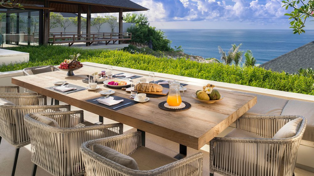 Outdoor dining with ocean views at Sohamsa Ocean Estate