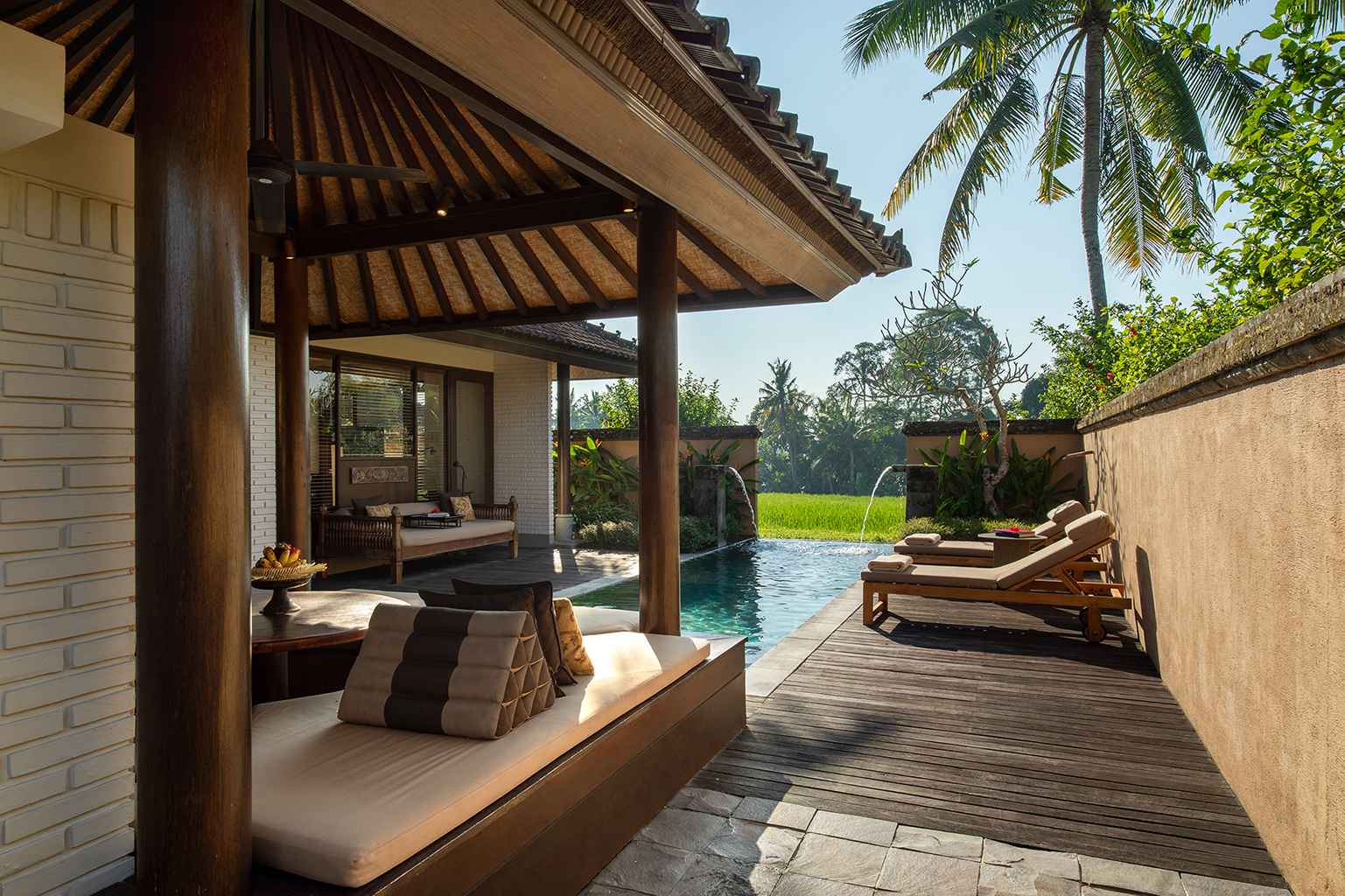 Private pool villa at Tanah Gajah opening onto a rice-field view near Ubud