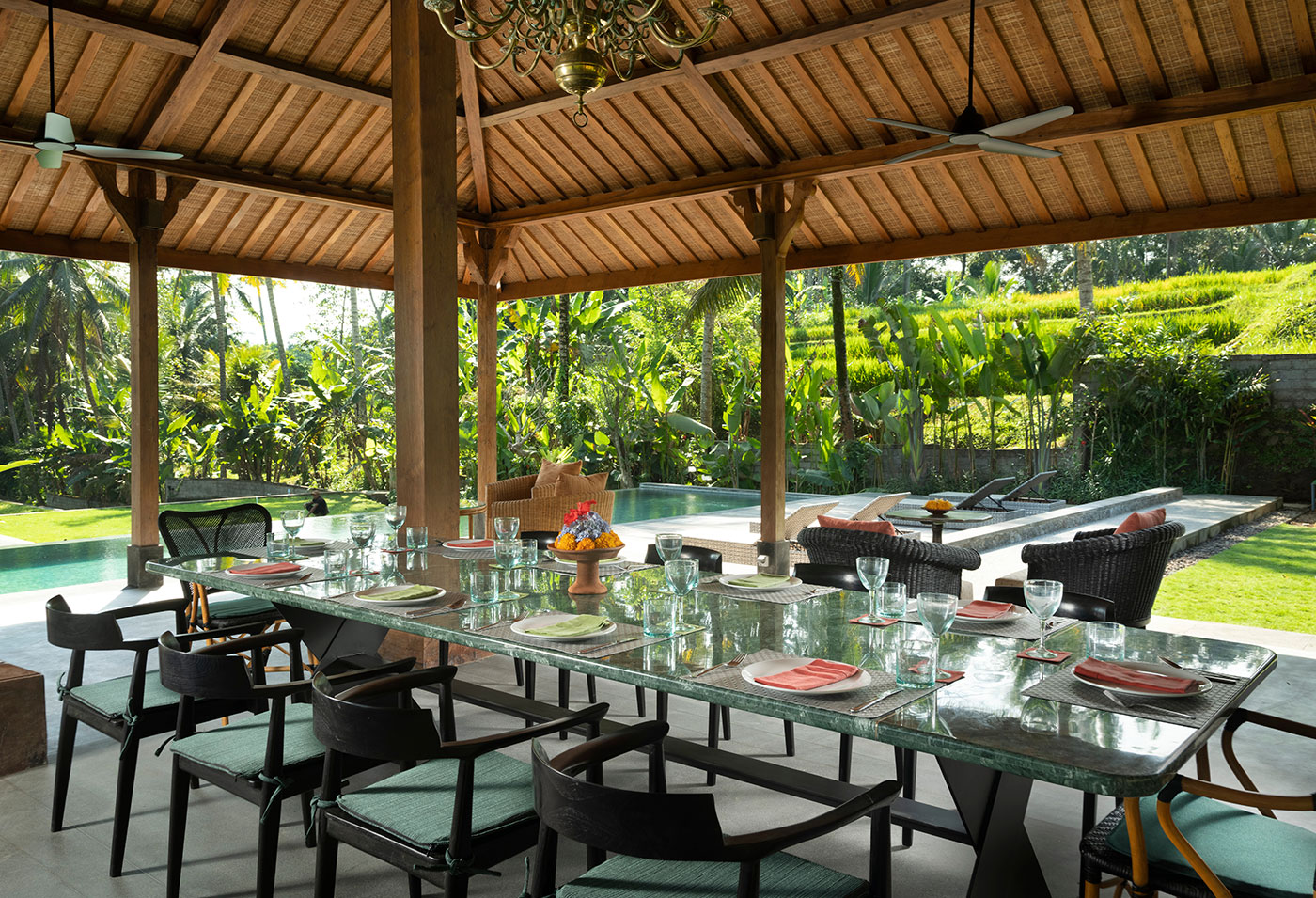 Dining pavilion with pool and rice field views at Teras Divya Ubud