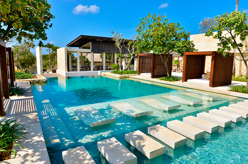 A private-pool pavilion villa at The Bale on the Bukit Peninsula near Nusa Dua, clean minimalist architecture opening to the garden