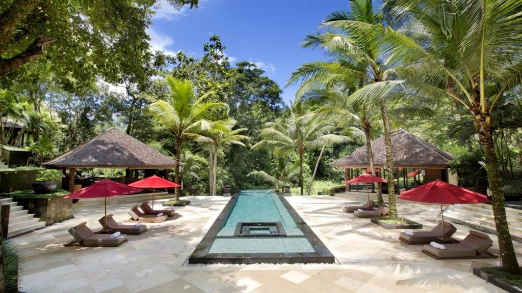 The grounds at The Sanctuary Bali, wide lawns leading toward the river