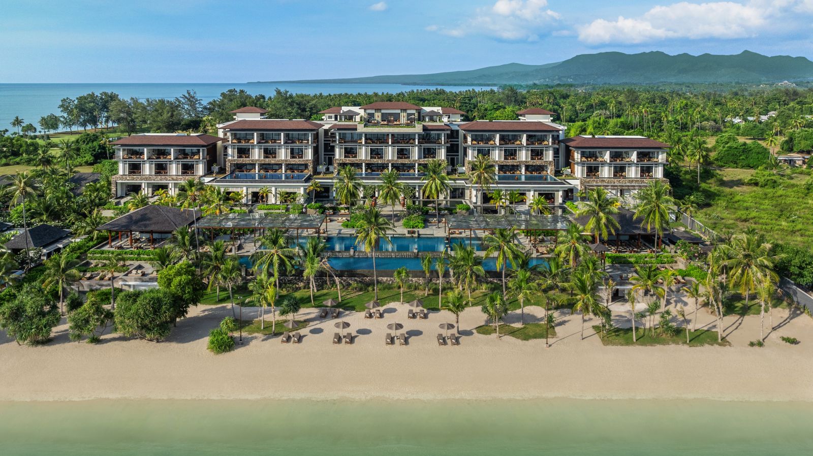Aerial view of The Sira resort along the white sand of Sira Bay, Lombok