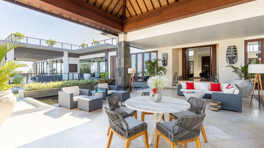 Bright oceanfront living space at Tirtha Bayu Estate looking to the Indian Ocean