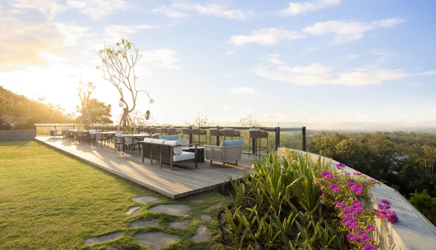 Outdoor sky-lounge seating with sunset views at The Tulou Bali, Jimbaran