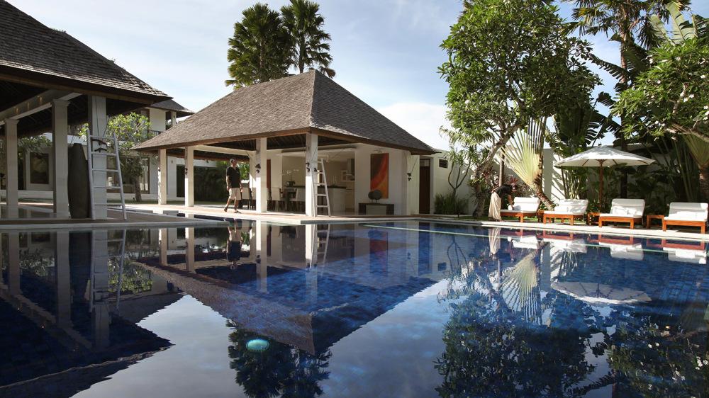 Poolside pavilion and lounge area at Villa Asante, seen across the pool