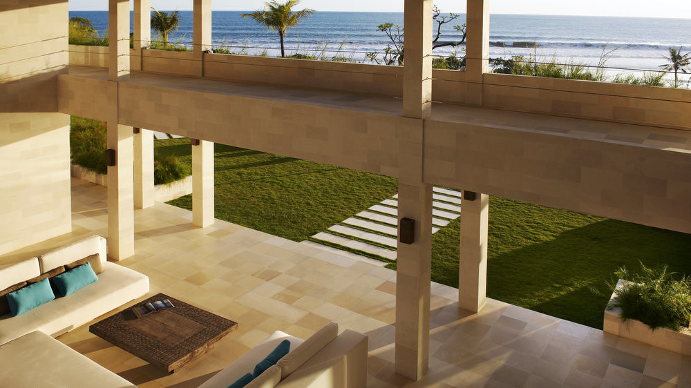 Open living pavilion at Villa Babar opening onto the lawn and the Indian Ocean