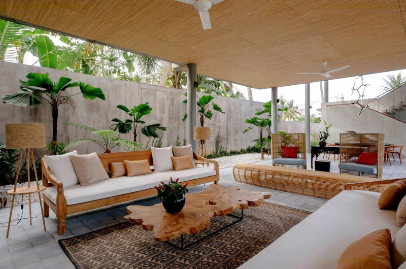 Open living pavilion with daybeds and tropical garden at Villa Casabama, near Saba Beach, Gianyar