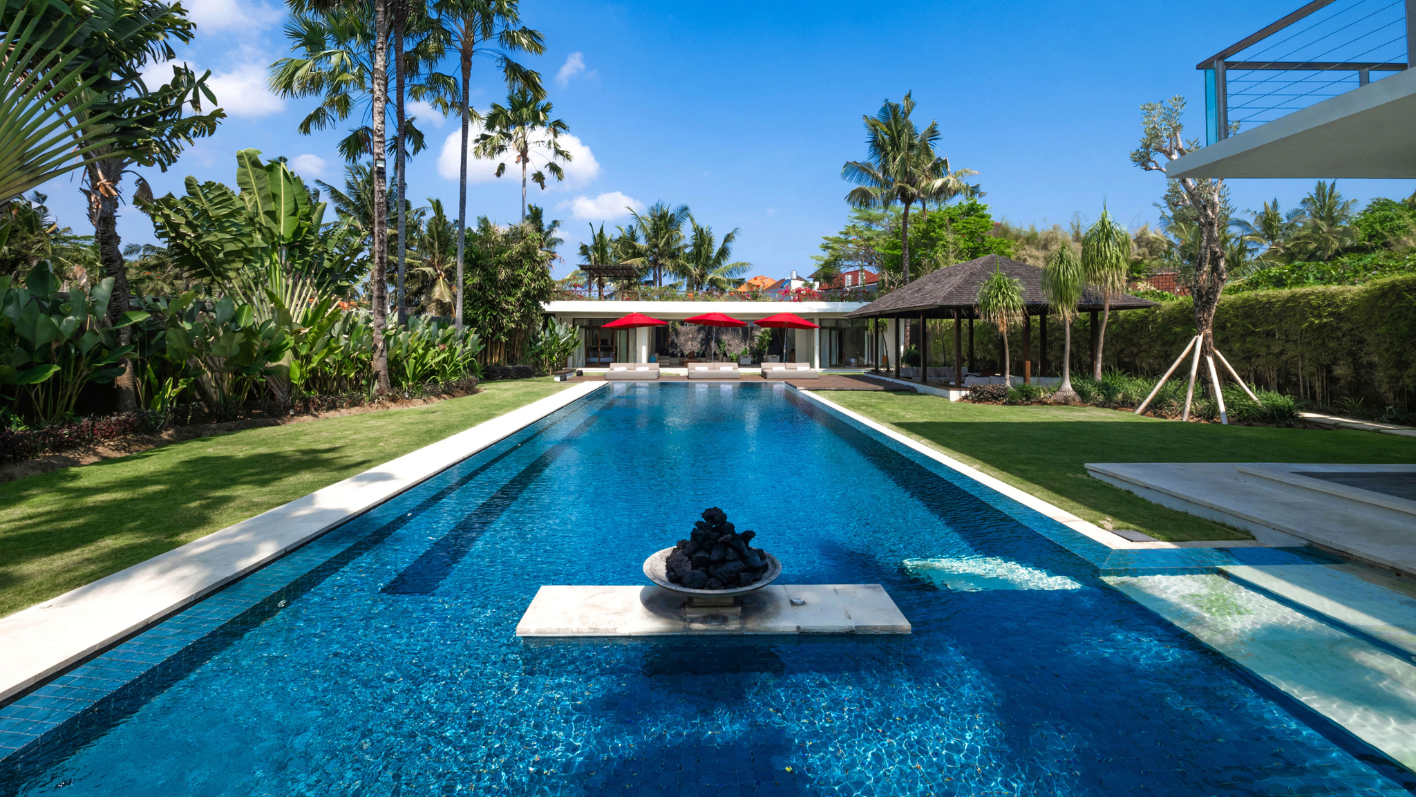 The expansive outdoor pool area at Villa Kalyani in Berawa, Canggu