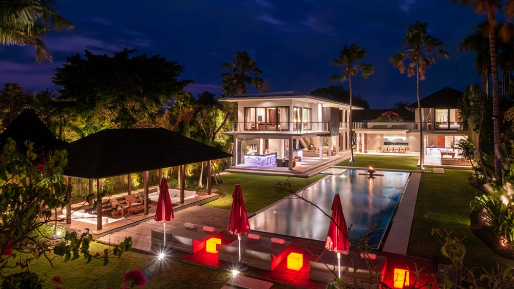 Villa Kalyani lit up at dusk with ambient lighting creating evening ambience, Berawa, Canggu