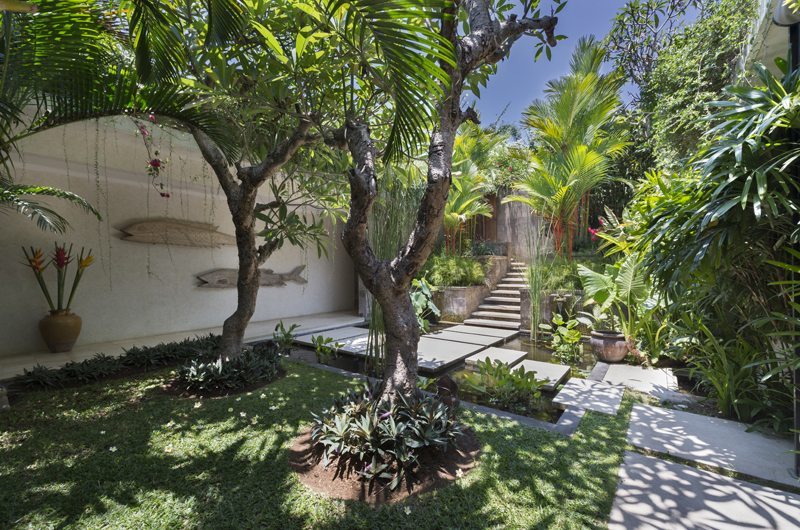 Garden courtyard and stepped stone path through tropical planting at Villa Kavaya