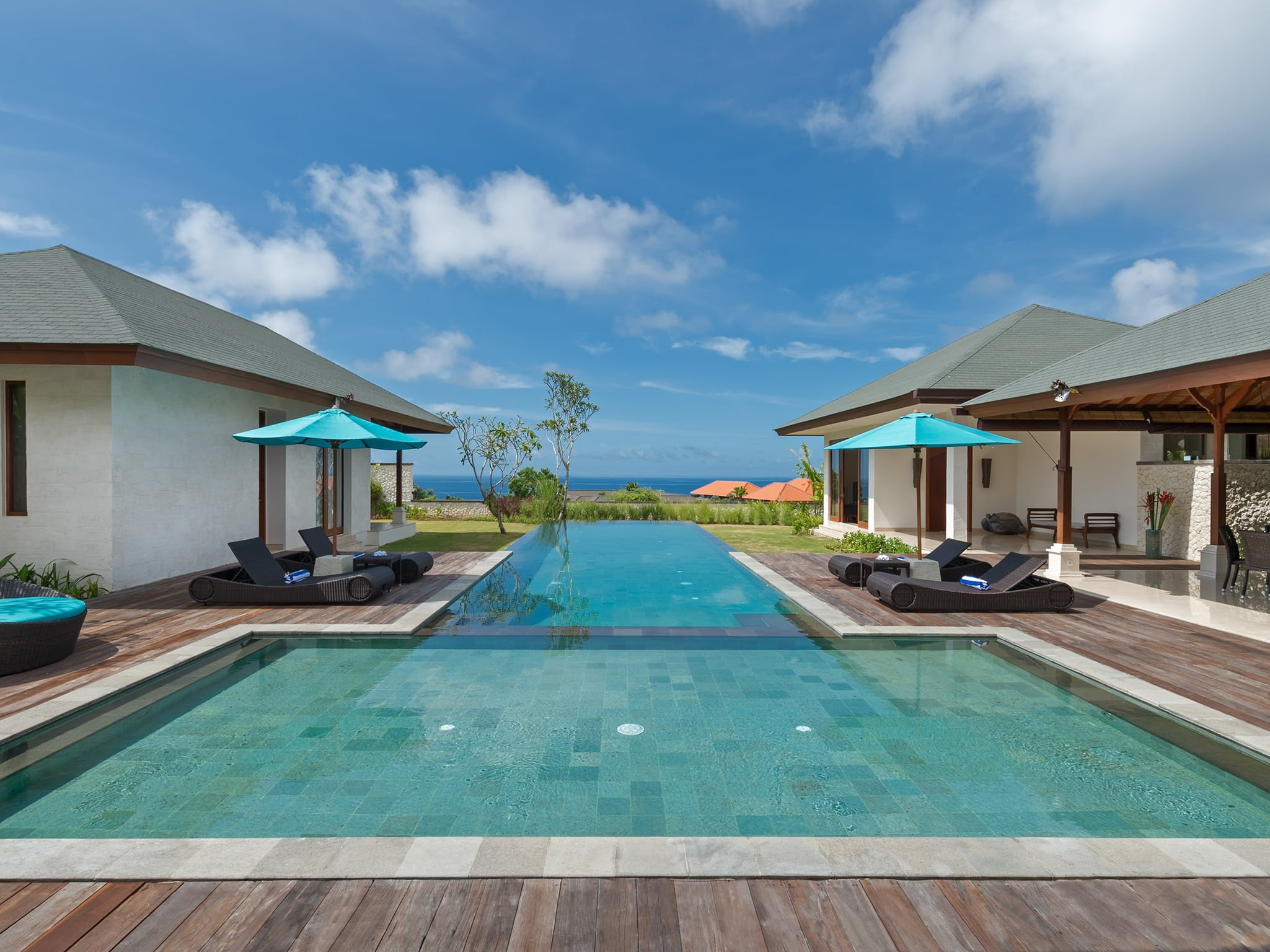 Poolside view toward the ocean at Villa Marie, Pandawa Cliff Estate