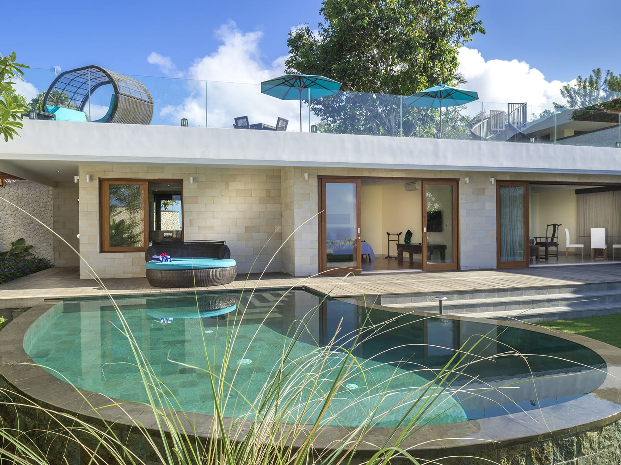 Poolside honeymoon suite terrace at Villa Markisa above Pandawa Beach