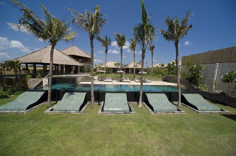 Open living pavilion at Villa Mary looking across the lawn to the ocean at Pererenan Beach