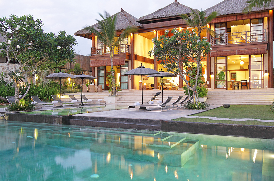 Villa Melissa at Pantai Lima Estate lit up at dusk, Canggu, Bali