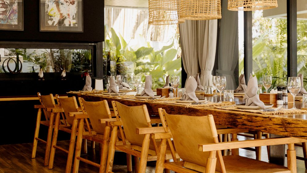 Contemporary tropical-style dining at Villa Nica overlooking the pool, Pererenan