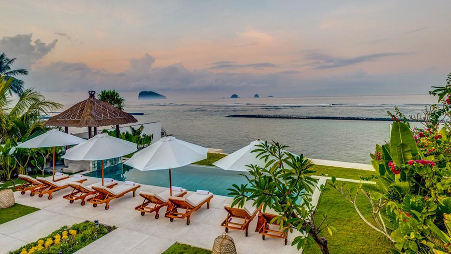 Sunset view of the sea and reef from Villa Oceana's pool deck in Candidasa