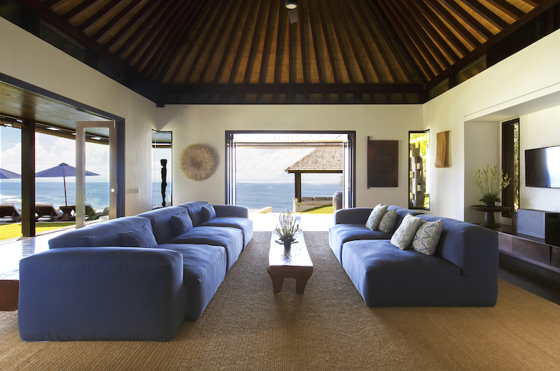 Open living pavilion at Villa Pawana opening to the pool and sea