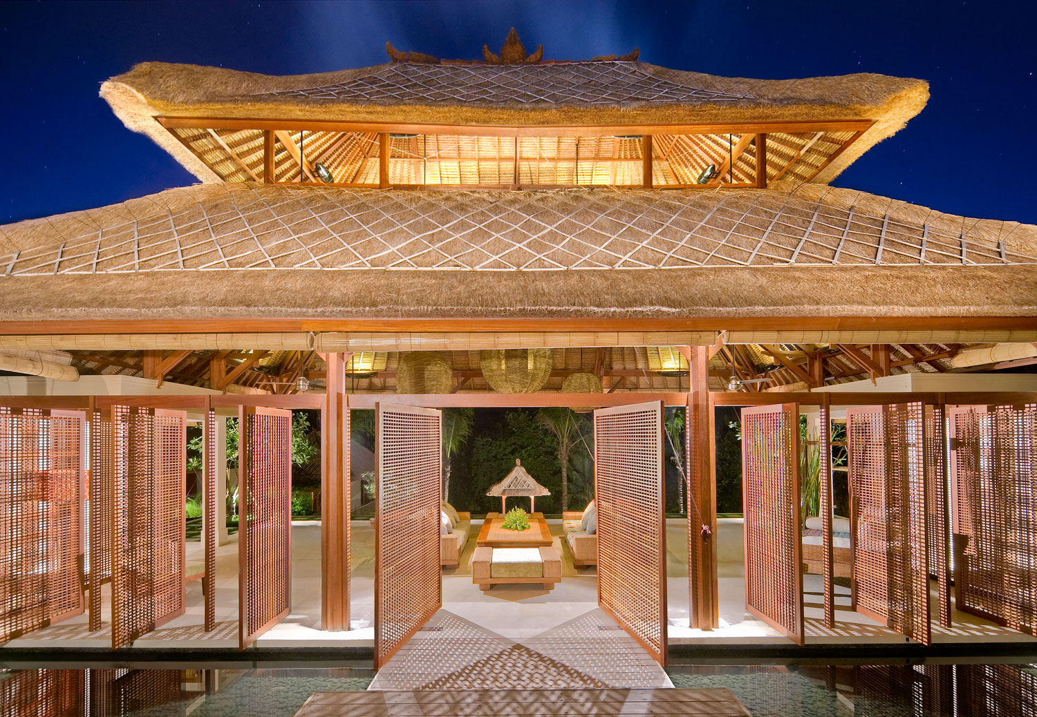 The wantilan-style living pavilion at Villa Puri Bawana lit up in the evening