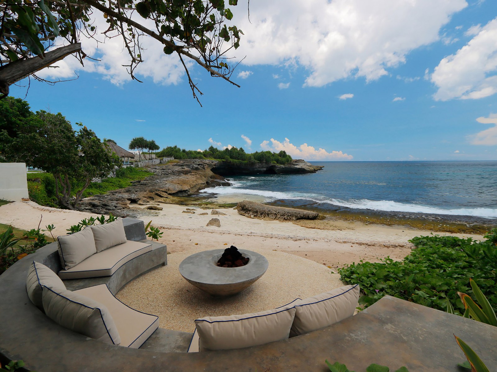 Beach-edge fire pit with cushioned seating overlooking the cove at Villa Seascape, Nusa Lembongan, Bali