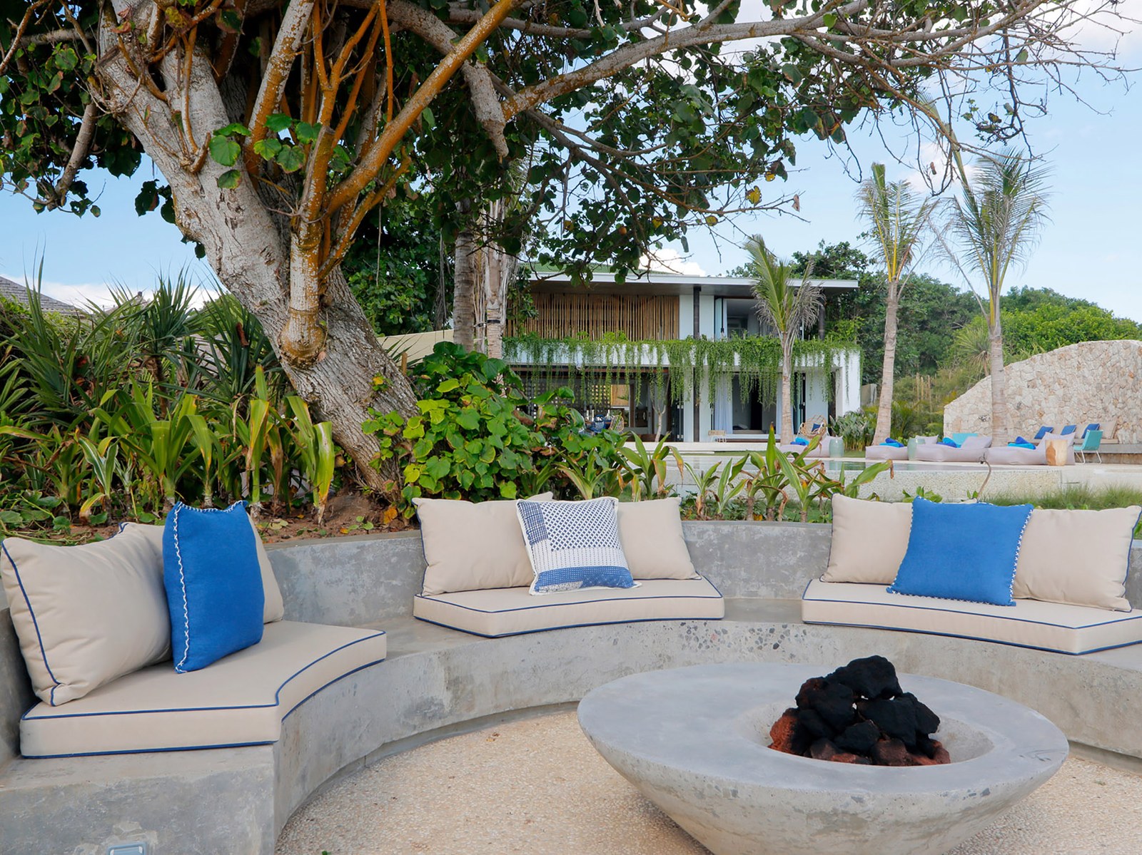 Circular sunken seating around a fire bowl in the garden at Villa Seascape, Sandy Bay, Nusa Lembongan, Bali