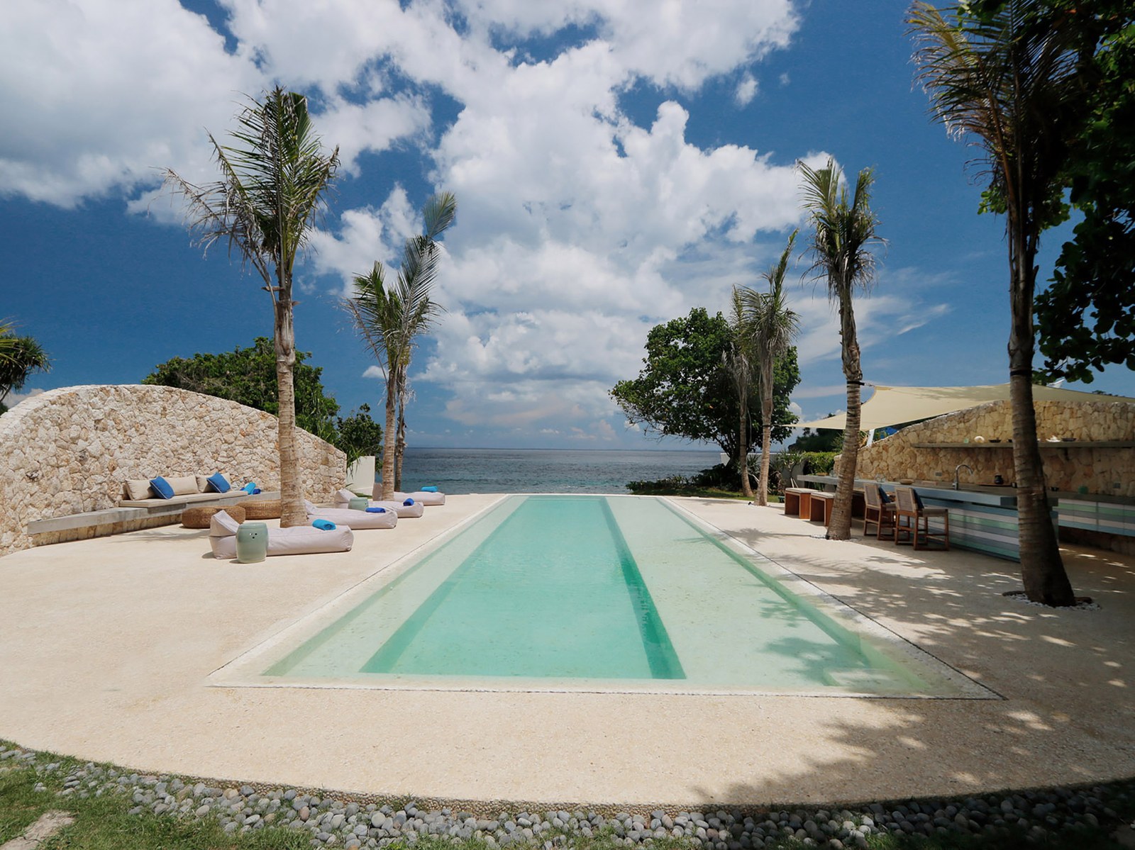 Pool and limestone terrace facing the sea at Villa Seascape on Sandy Bay, Nusa Lembongan, Bali