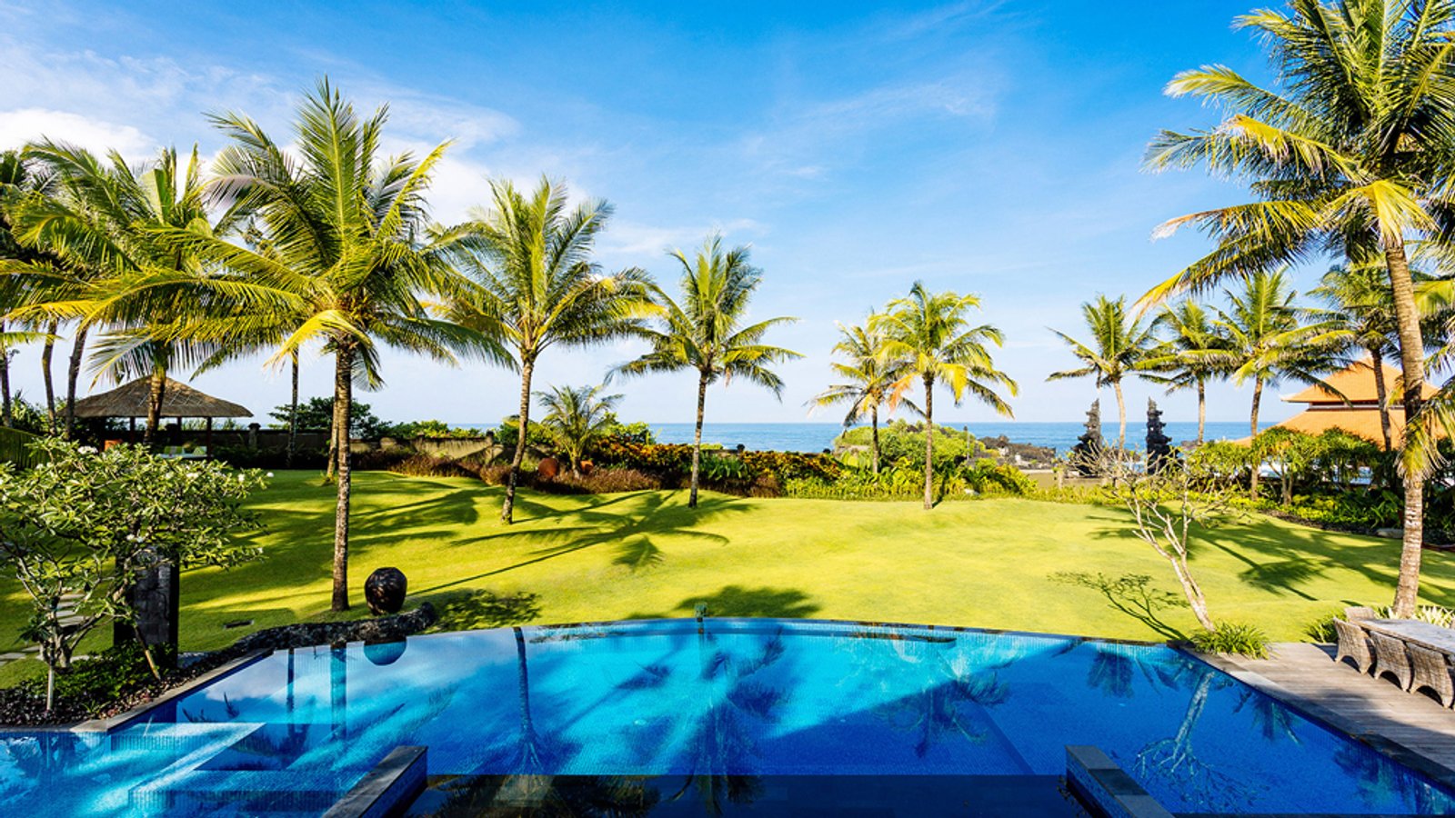 Beachfront lawn and gardens at Villa Semarapura, Seseh