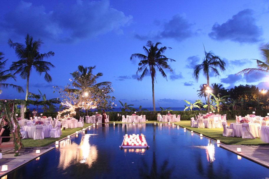 Evening reception lighting across the Villa Shalimar garden and pool
