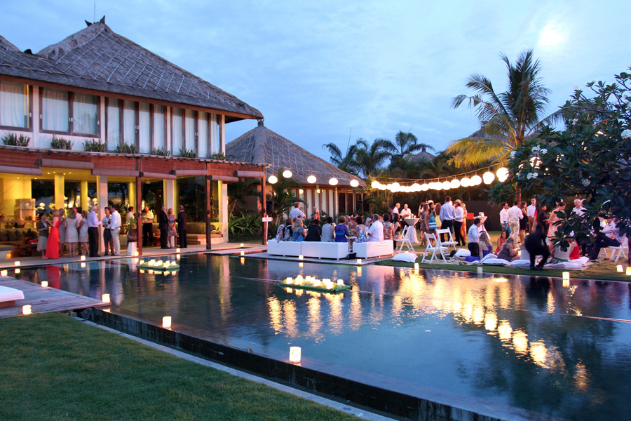 Poolside wedding reception set up at Villa Shalimar in Canggu, Bali, with the pool and lawn styled for guests