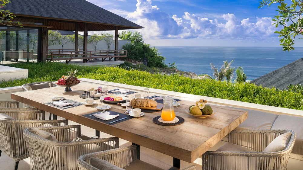 Outdoor dining with an ocean view at Villa Soham